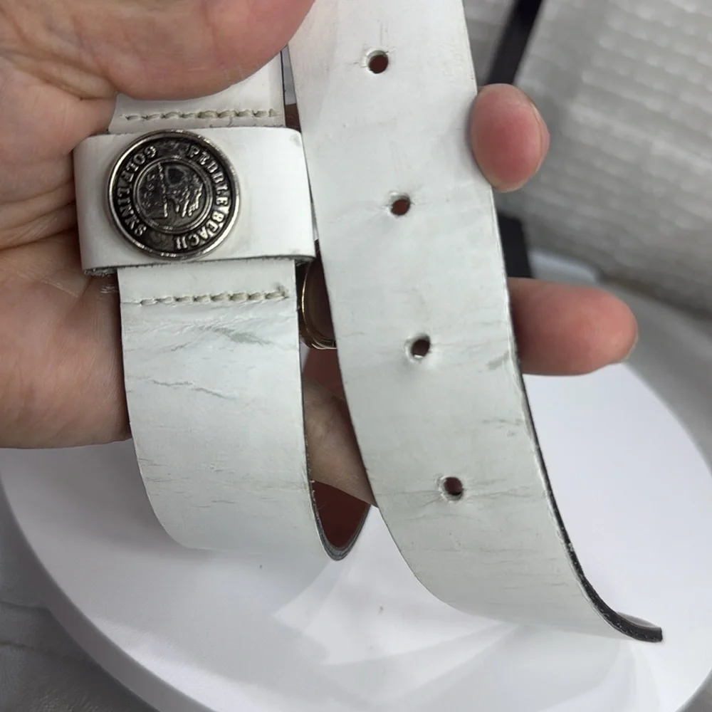 (H)Two Pebble Beach boys' leather belts with black and white metal silve buckles